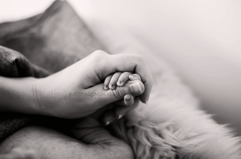 mummy holding baby's hand